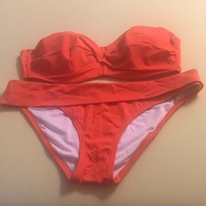 Victory’s Secret orange 2 piece swimsuit.